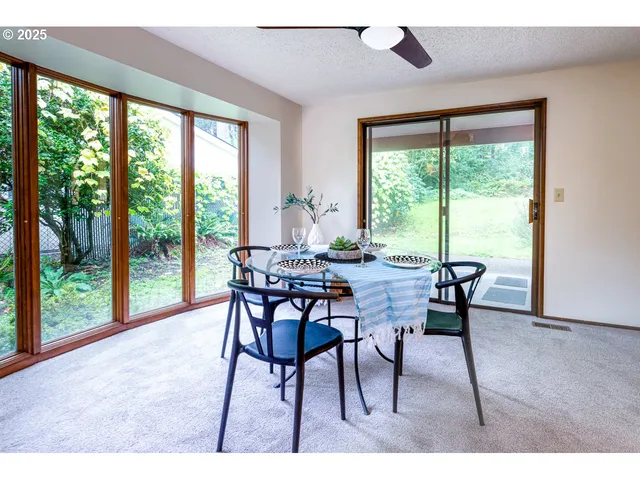 a dining room with furniture and window