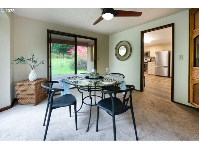 a view of a kitchen with furniture wooden floor and window