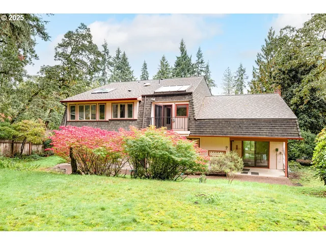a backyard of a house with lots of green space