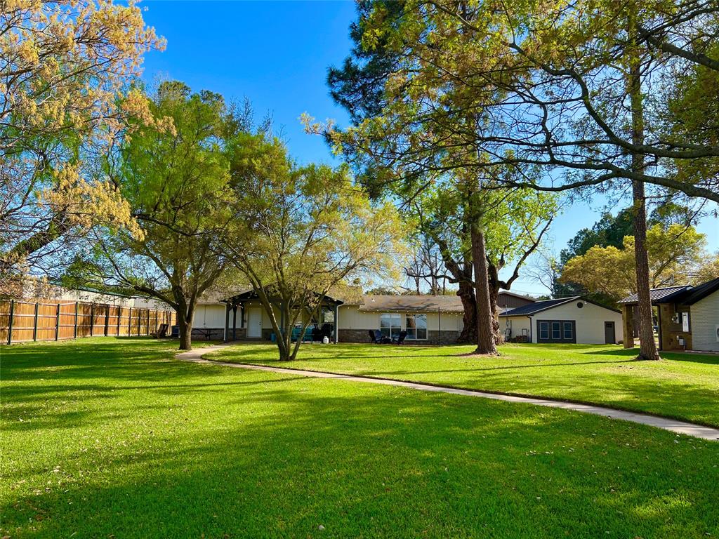 1957 Deer Trail Road Graford, TX 76449 - Photo 5 of 32 Gorgeous Big Grassy Yard with Level Easy Access to the Water and Sandy Beach on 1.18 Acres with Endless Possibilities.