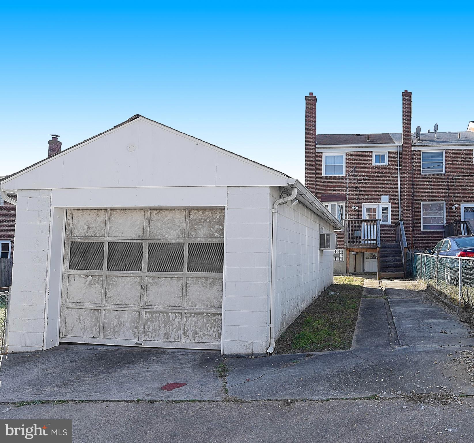 4423 Fenor Road Baltimore, MD 21227 - Photo 25 of 28 a front view of a house with a yard