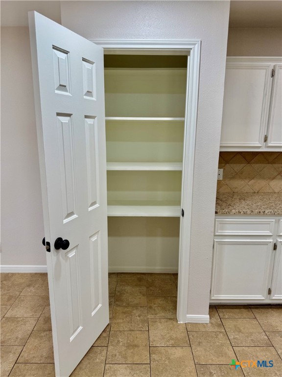 210 Stone Gate Drive Victoria, TX 77904 - Photo 11 of 23 a view of room with walk in closet and window