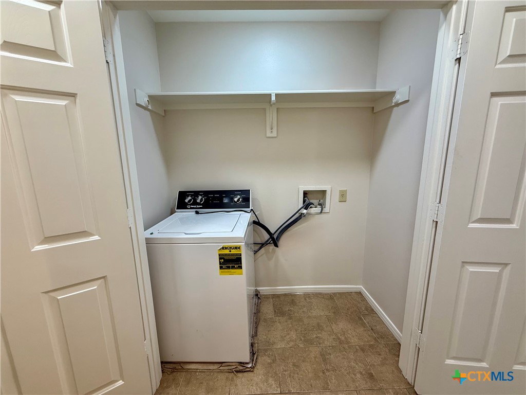 210 Stone Gate Drive Victoria, TX 77904 - Photo 16 of 23 a utility room with dryer and washer