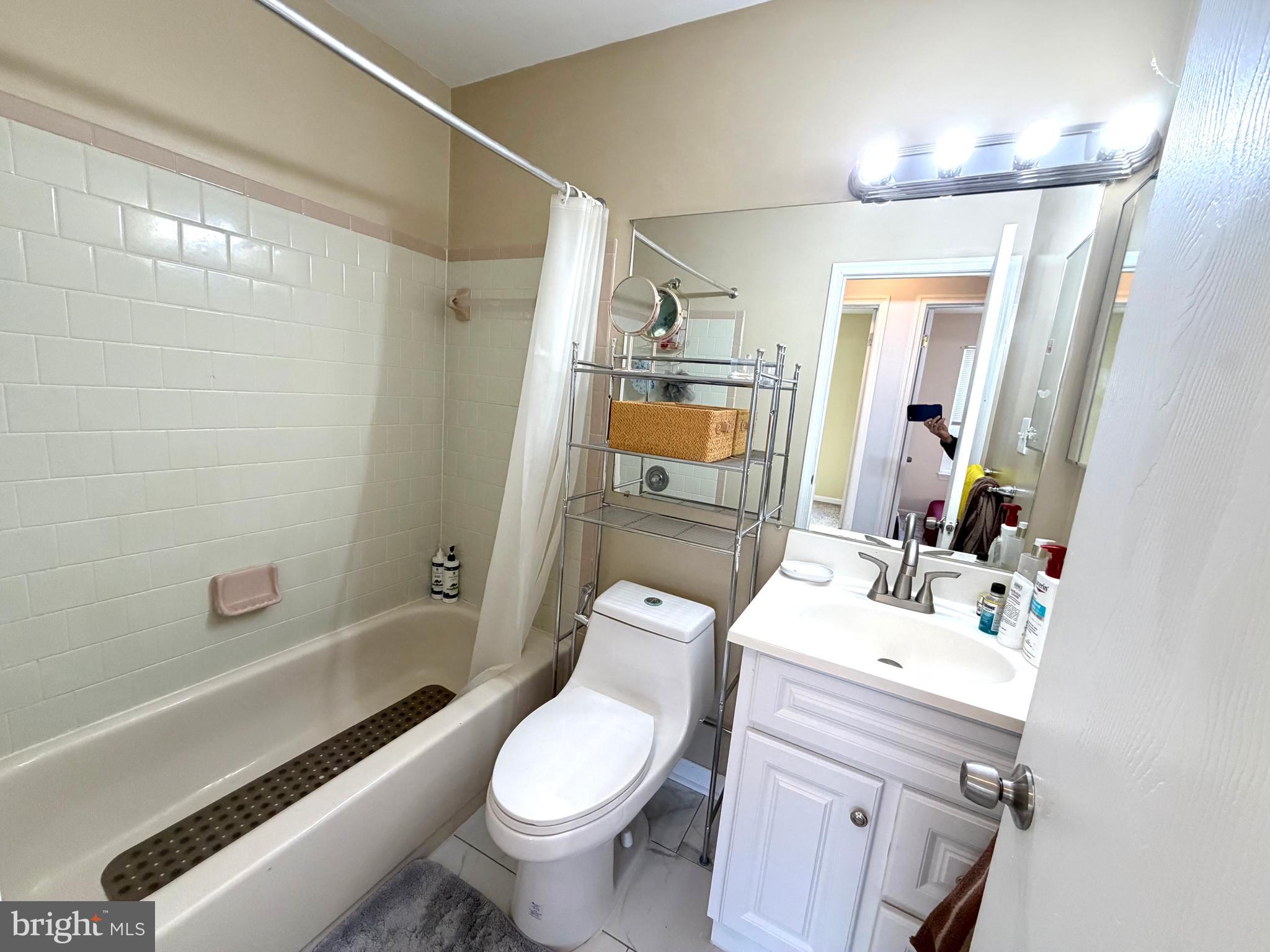 8 Hardwood Drive Rosedale, MD 21237 - Photo 18 of 42 a bathroom with a sink a toilet and shower