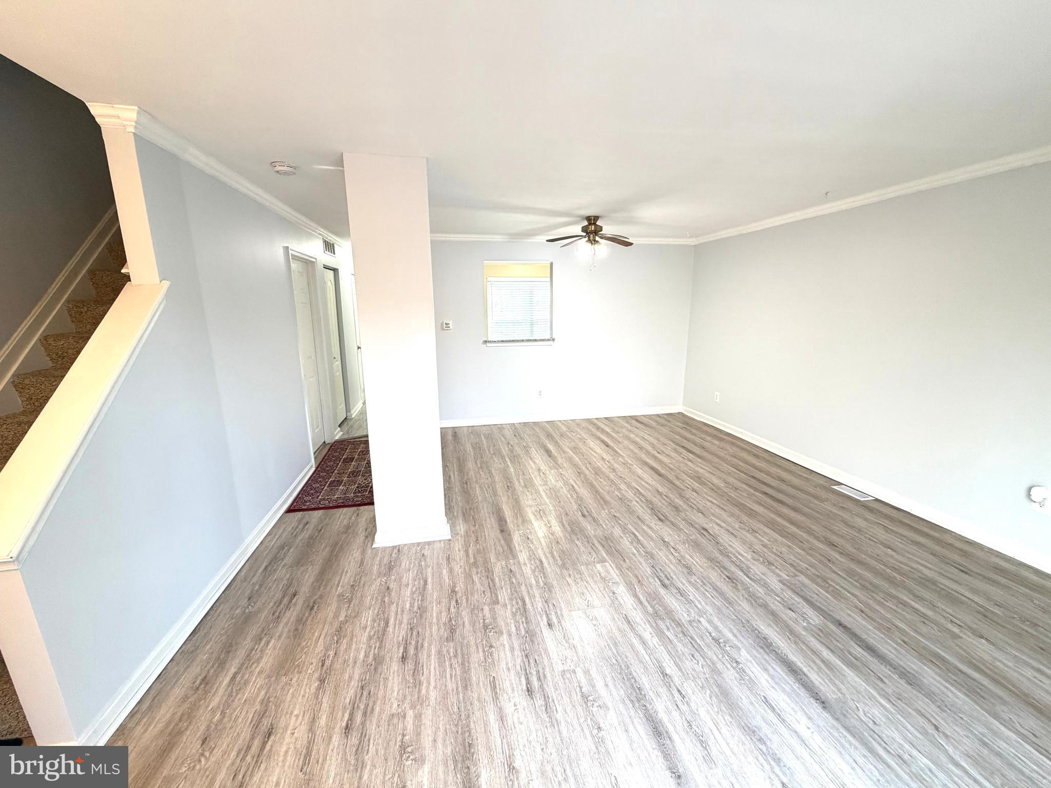 8 Hardwood Drive Rosedale, MD 21237 - Photo 2 of 42 a view of empty room with wooden floor and fan