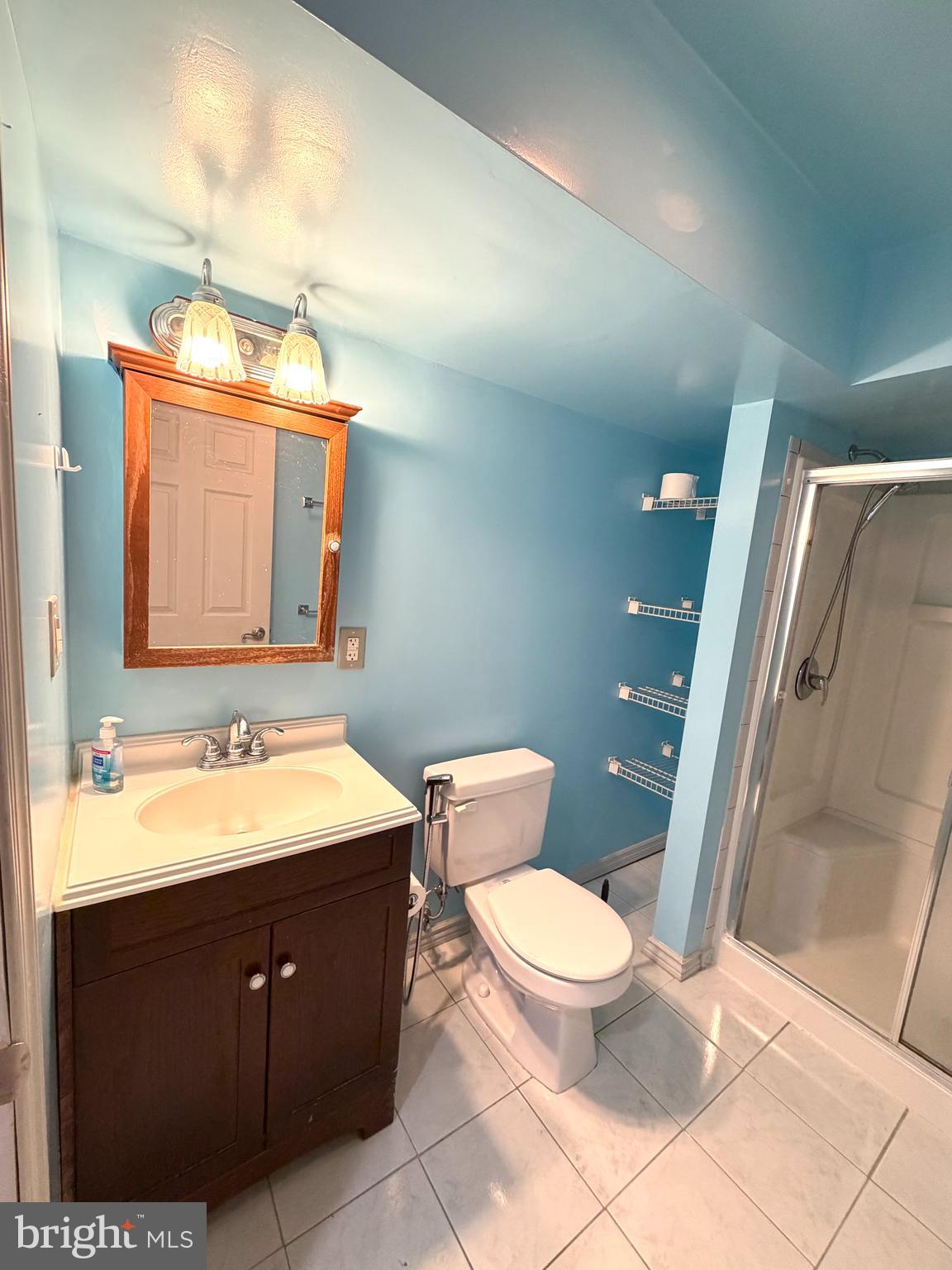 8 Hardwood Drive Rosedale, MD 21237 - Photo 27 of 42 a bathroom with a toilet sink and mirror