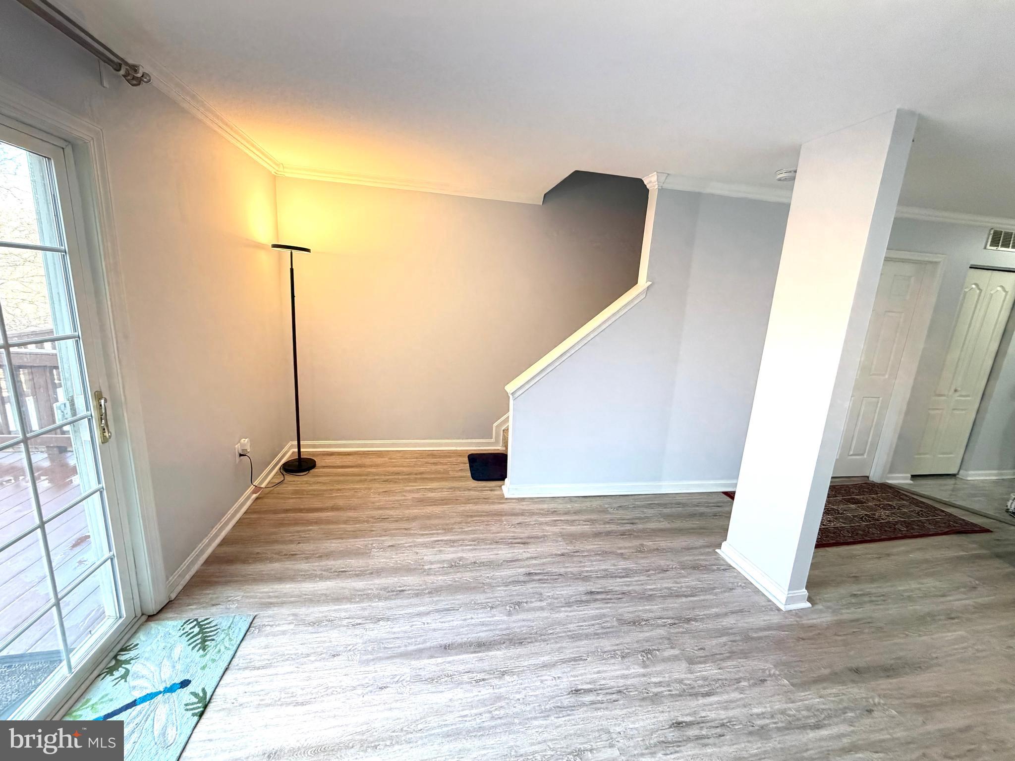 8 Hardwood Drive Rosedale, MD 21237 - Photo 3 of 42 a view of an empty room with wooden floor