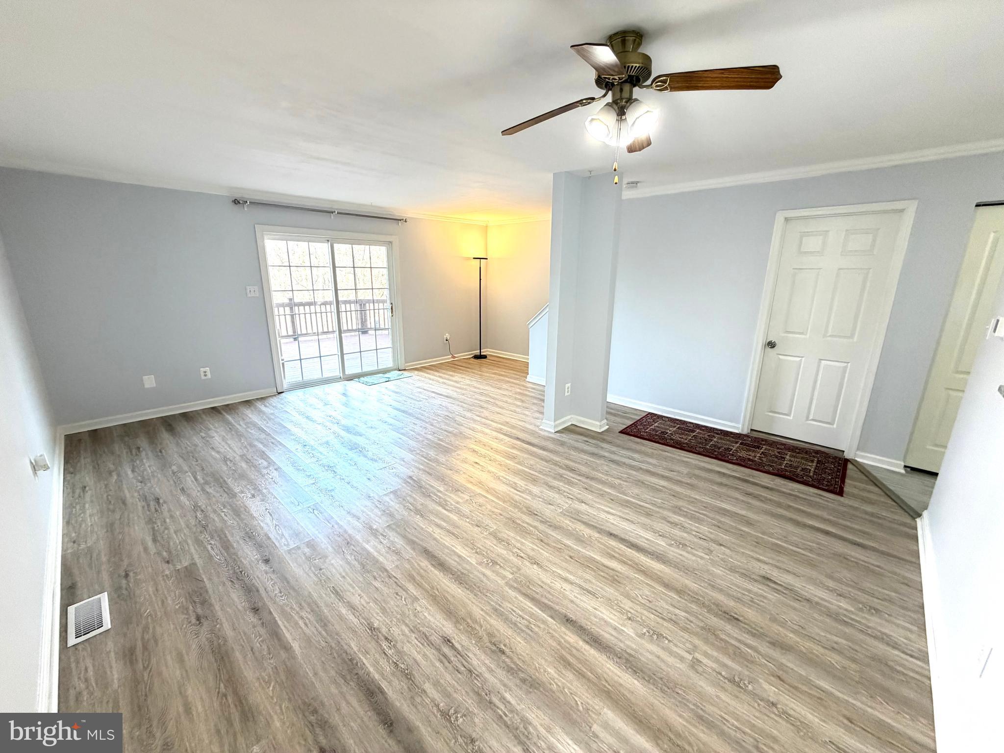 8 Hardwood Drive Rosedale, MD 21237 - Photo 4 of 42 a view of empty room with wooden floor and fan