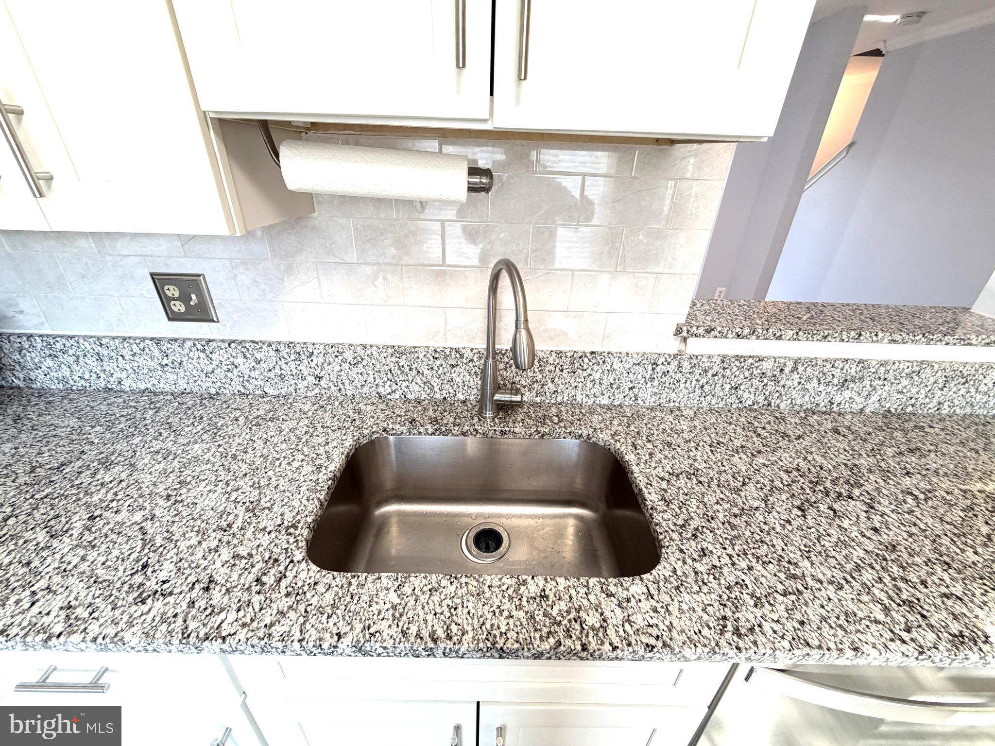 8 Hardwood Drive Rosedale, MD 21237 - Photo 7 of 42 a kitchen with a sink and a stove