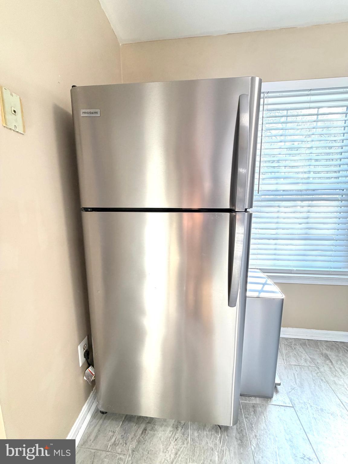 8 Hardwood Drive Rosedale, MD 21237 - Photo 8 of 42 a white refrigerator freezer sitting in a kitchen