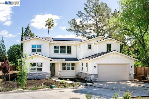 a kitchen with a table chairs sink and cabinets