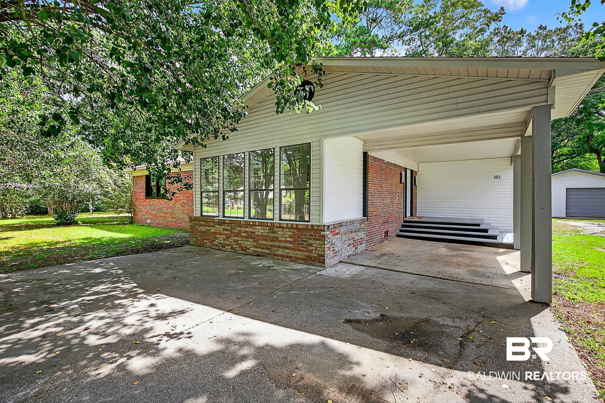 101 Terry Avenue Brewton, AL 36426 - Photo 2 of 48 View of front of home featuring brick siding and a front yard