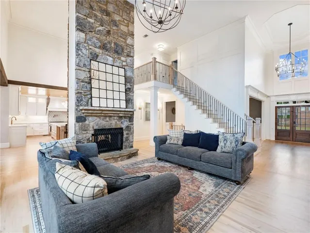 a view of a roof deck with table and chairs and wooden floor