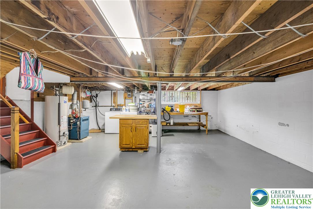 2750 Belaire Road Bethlehem, PA 18017 - Photo 39 of 56 An unfinished lower level offers painted concrete floors under exposed wooden ceiling joists.