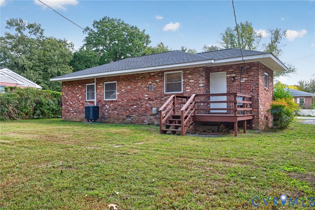 1118 Andros Road Richmond, VA 23225 - Photo 27 of 28 Red brick exterior featuring a black shingle roof,