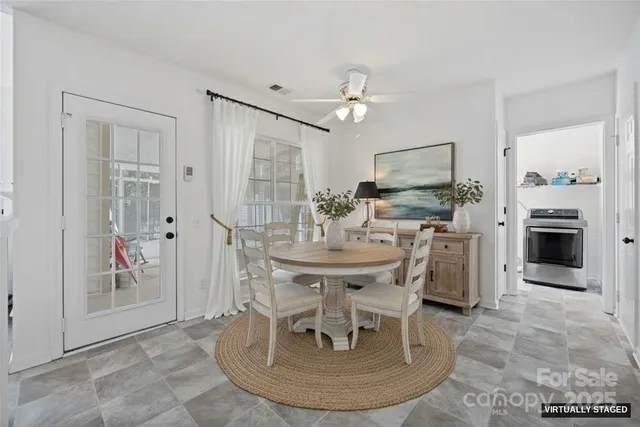 a view of a livingroom with furniture and a fireplace