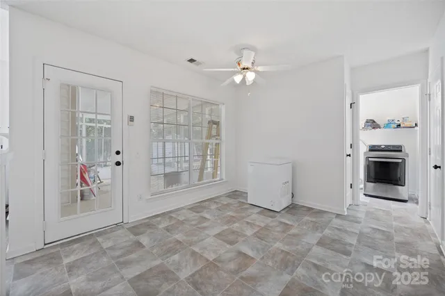 wooden floor in an empty room with a fireplace