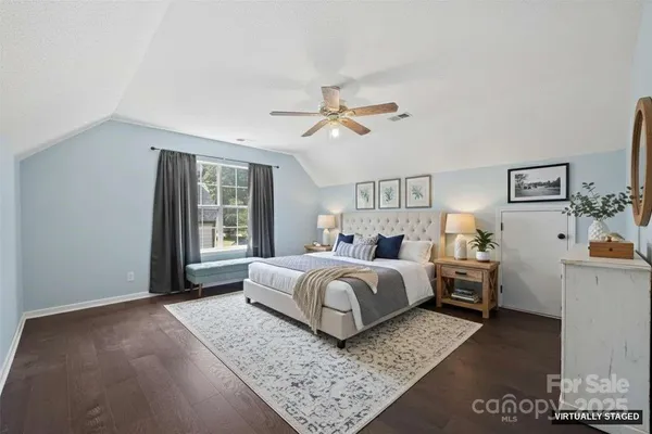 a bed room with bed and window