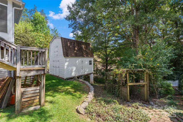 a backyard of a house with lots of green space