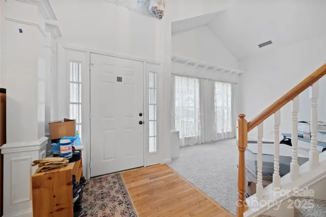 a view of livingroom with furniture and workspace