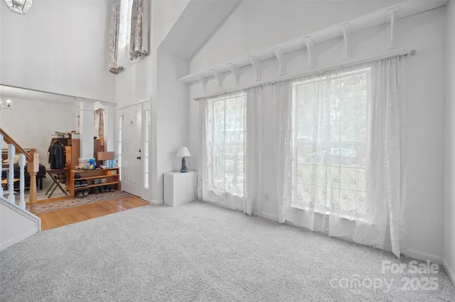 a view of a livingroom with furniture and a window