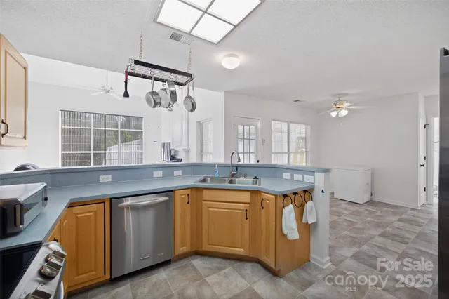 a kitchen with a sink and cabinets