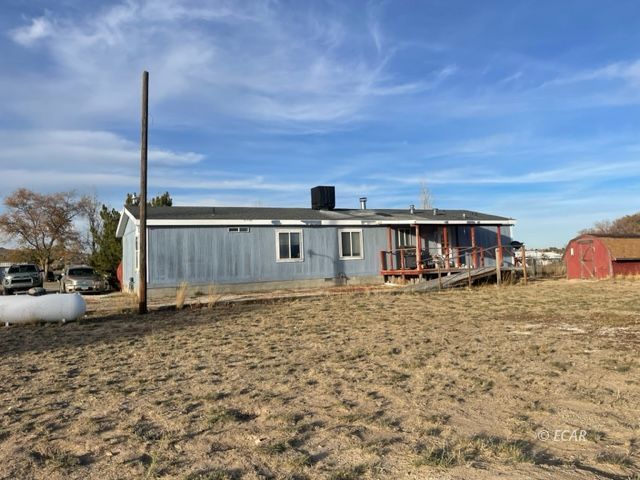 953 Spring Valley Parkway Spring Creek, NV 89815 - Photo 17 of 17 a front view of a house with a yard