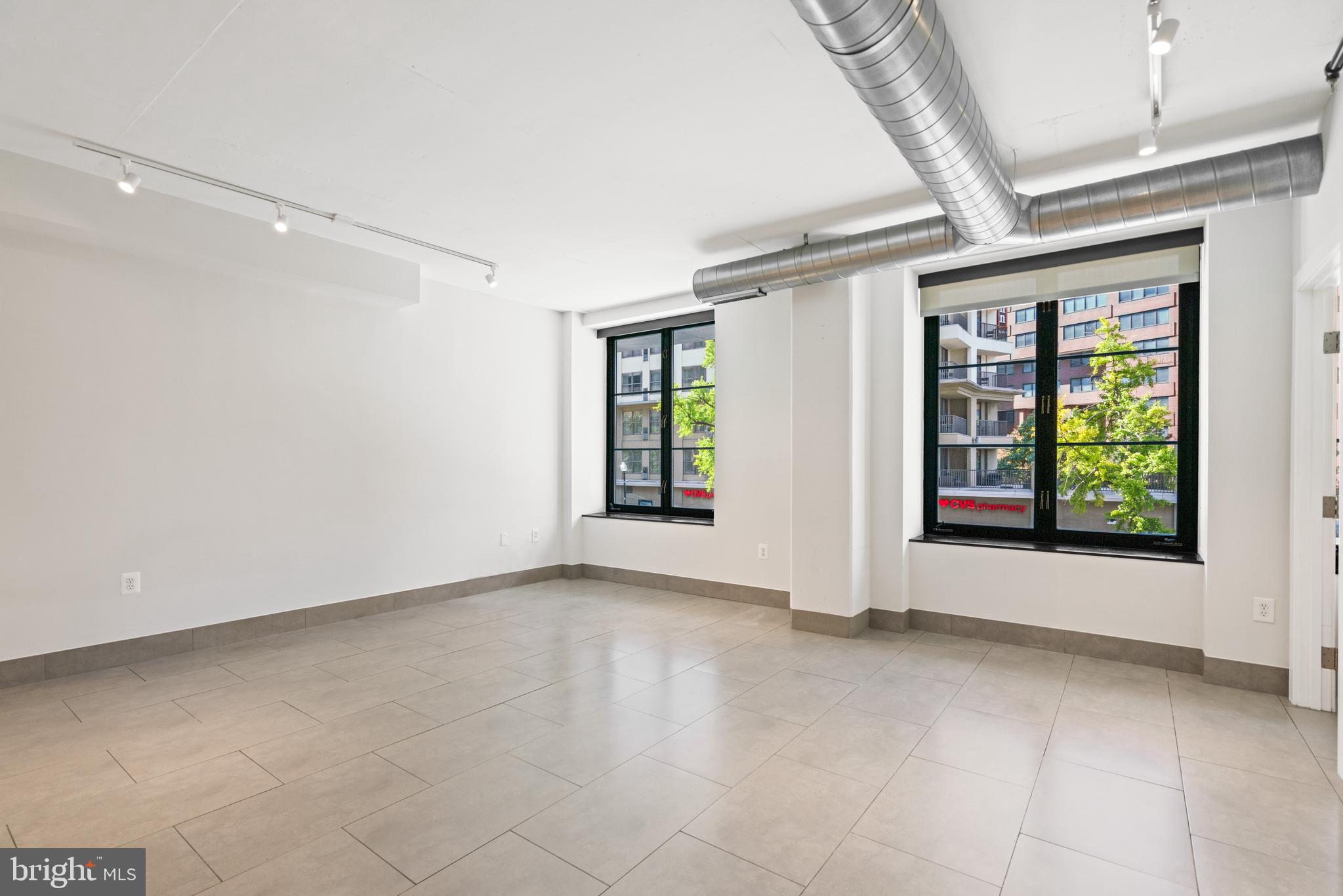 1133 14th Street Northwest, Unit 208 Washington, DC 20005 - Photo 6 of 27 Large open living / dining area