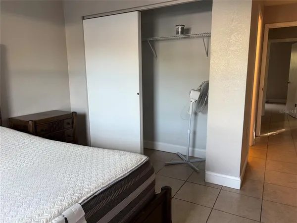 a room with a table and a refrigerator