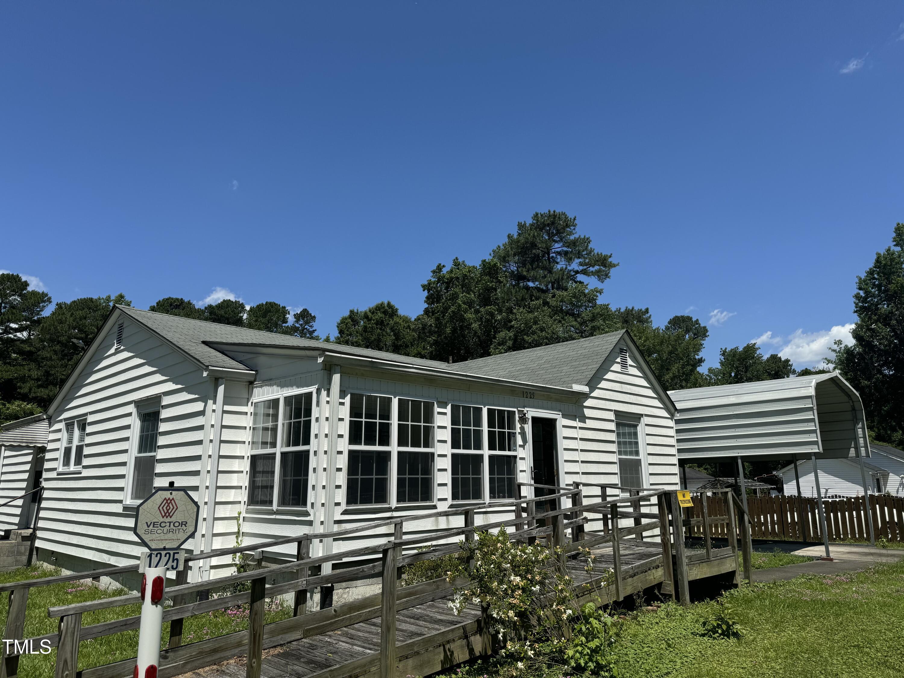 1225 Junction Road Durham, NC 27704 - Photo 1 of 10 a front view of a house with a yard