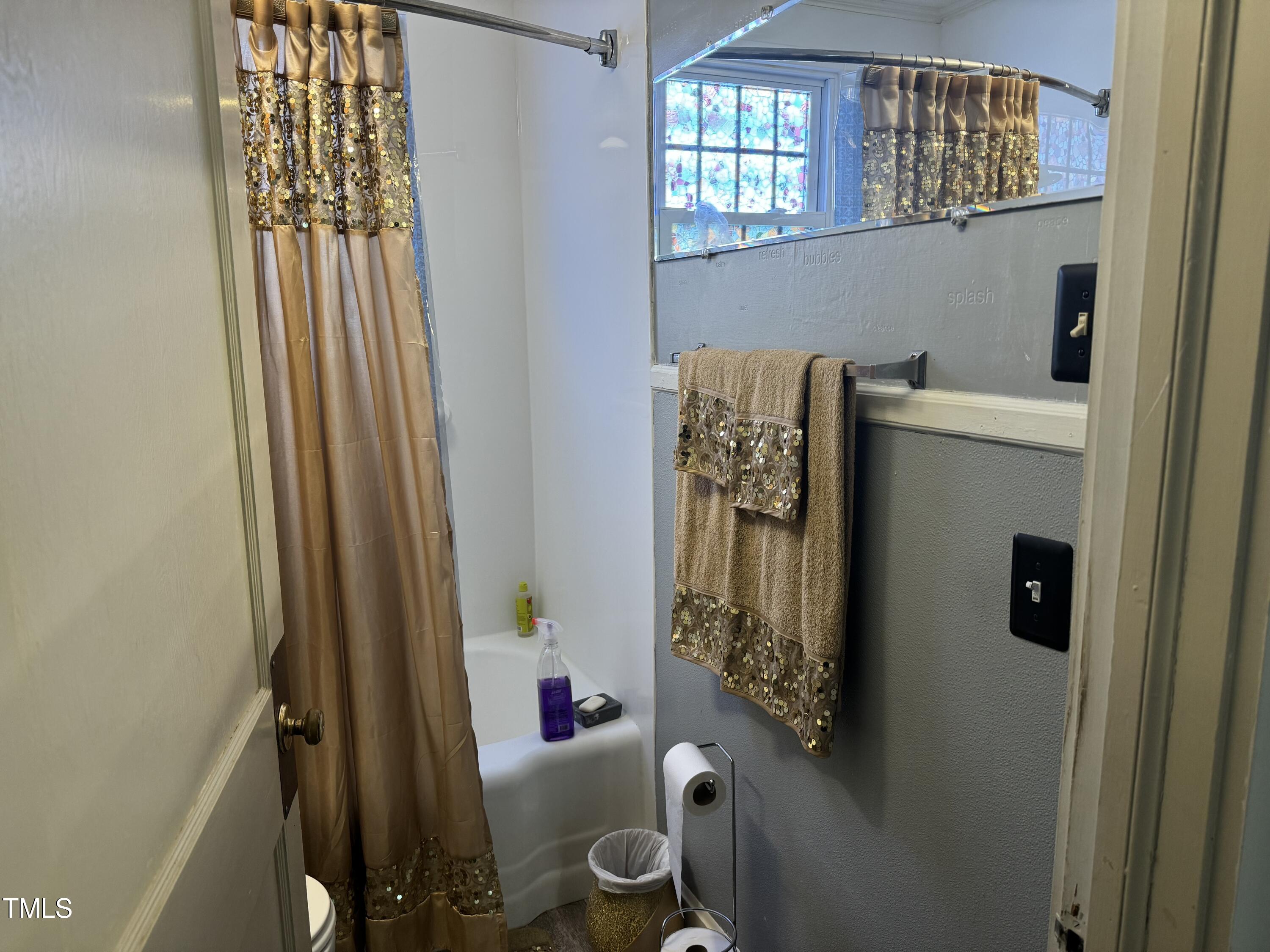 1225 Junction Road Durham, NC 27704 - Photo 5 of 10 a bathroom with a sink toilet and shower