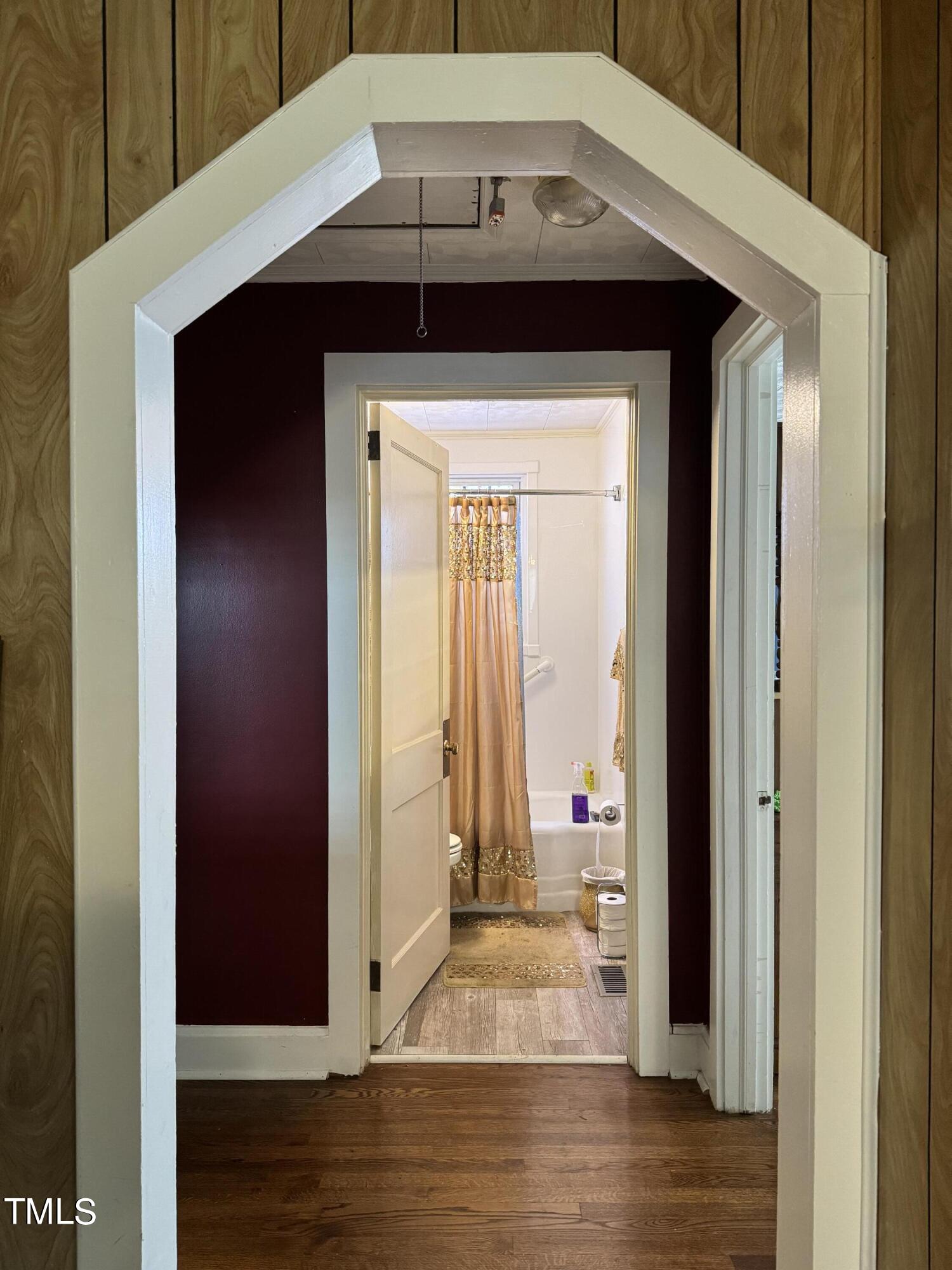 1225 Junction Road Durham, NC 27704 - Photo 6 of 10 a view of a hallway with wooden floor and staircase