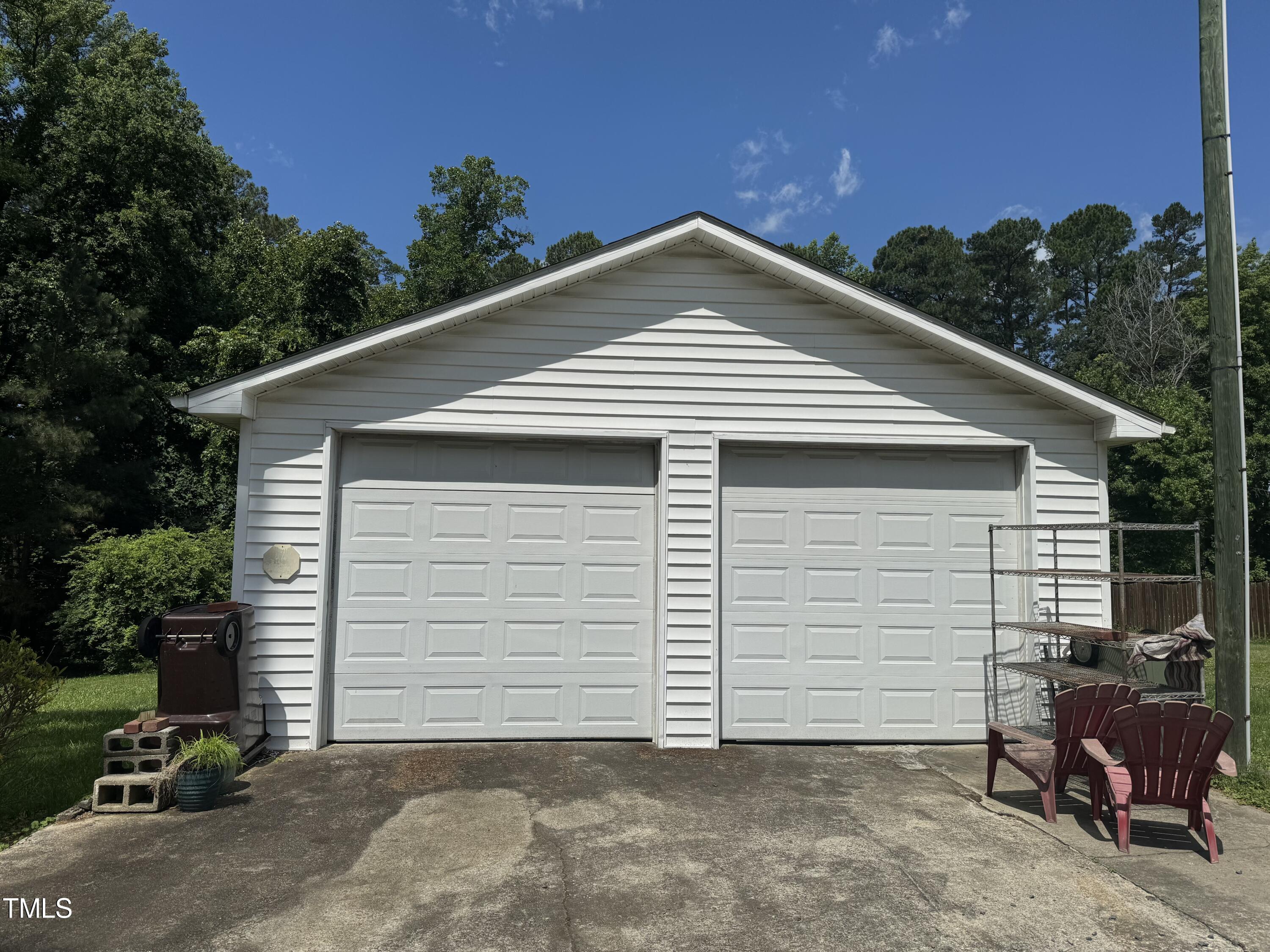 1225 Junction Road Durham, NC 27704 - Photo 7 of 10 a side view of a house with garage