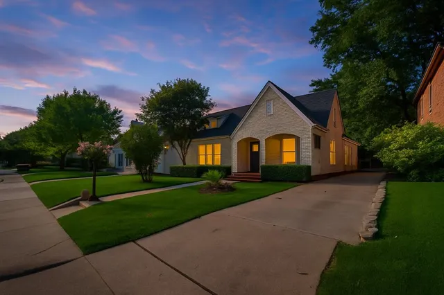a front view of a house with garden