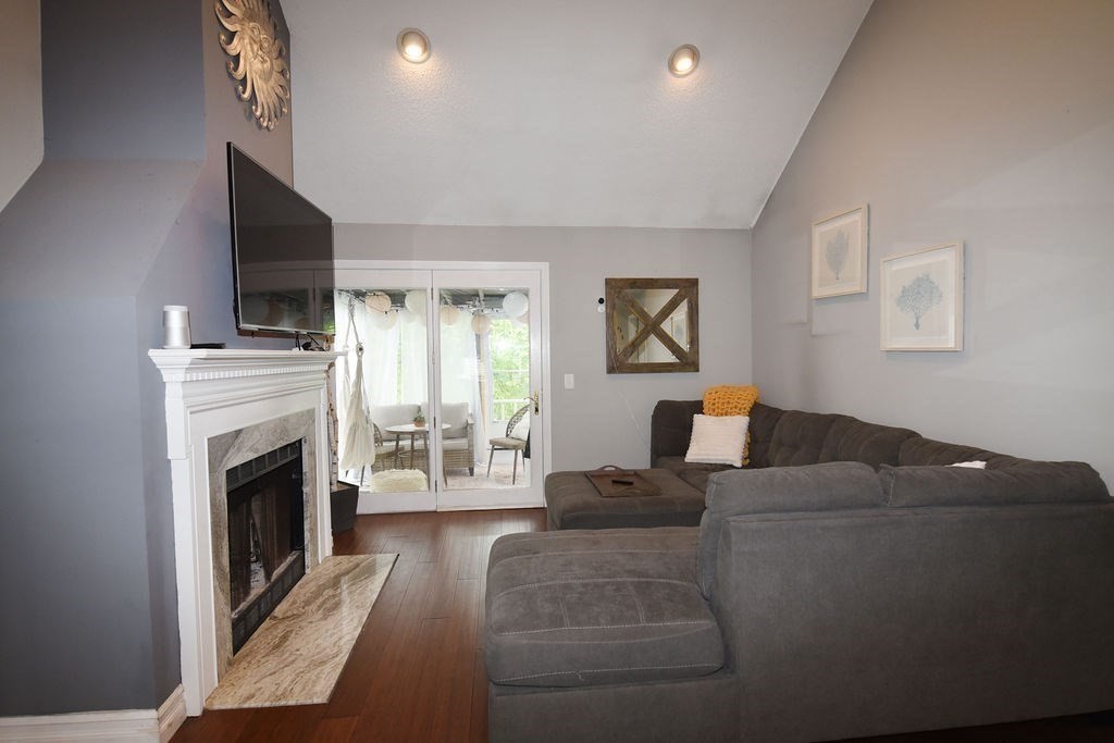 1559 Bay Street, Unit 53 Taunton, MA 02780 - Photo 17 of 40 a living room with furniture and a fireplace