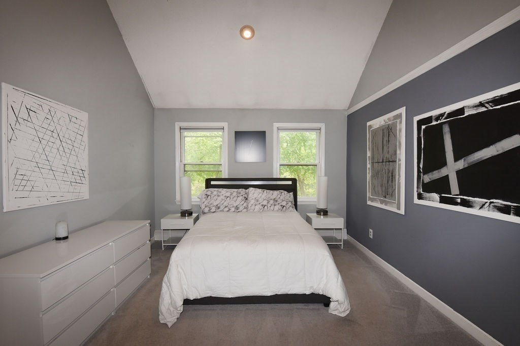 1559 Bay Street, Unit 53 Taunton, MA 02780 - Photo 24 of 40 a spacious bedroom with a bed and a large window