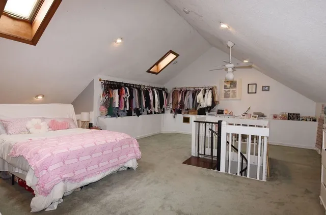 a bedroom with furniture and baby crib