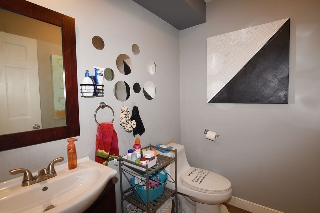 1559 Bay Street, Unit 53 Taunton, MA 02780 - Photo 29 of 40 a bathroom with a sink and a mirror