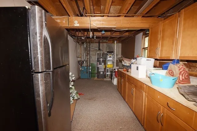 a kitchen with stainless steel appliances a refrigerator and a sink