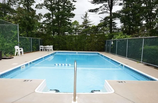 a view of a swimming pool with a patio