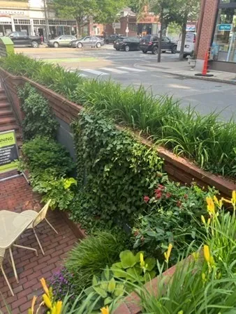 a view of yard with green space and seating area