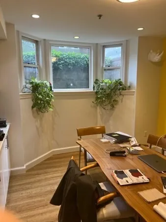 a workspace with furniture and window