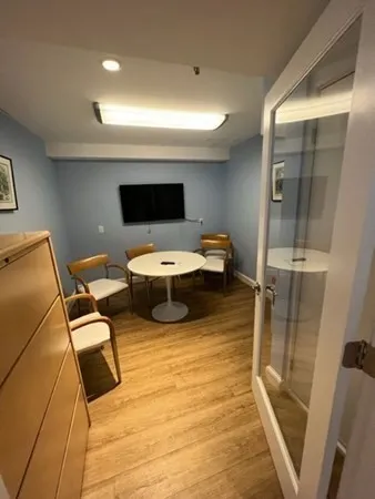 a room with furniture and a flat screen tv