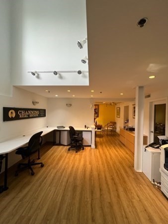 1776 Massachusetts Avenue, Unit 2A Cambridge, MA 02140 - Photo 10 of 14 a living room with furniture and a wooden floor