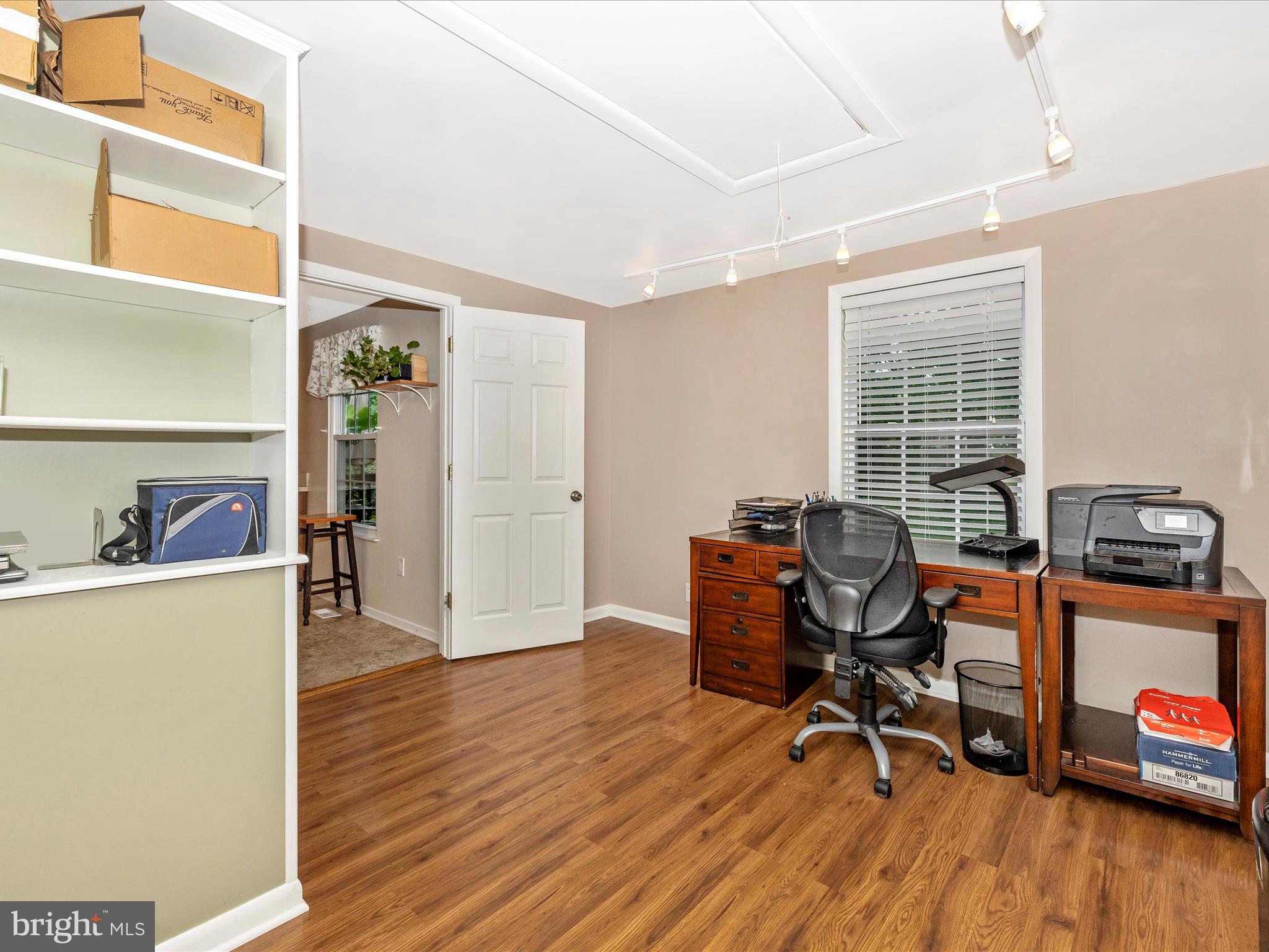 4310 Zircon Road Middletown, MD 21769 - Photo 23 of 86 a view of a workspace with furniture and a window
