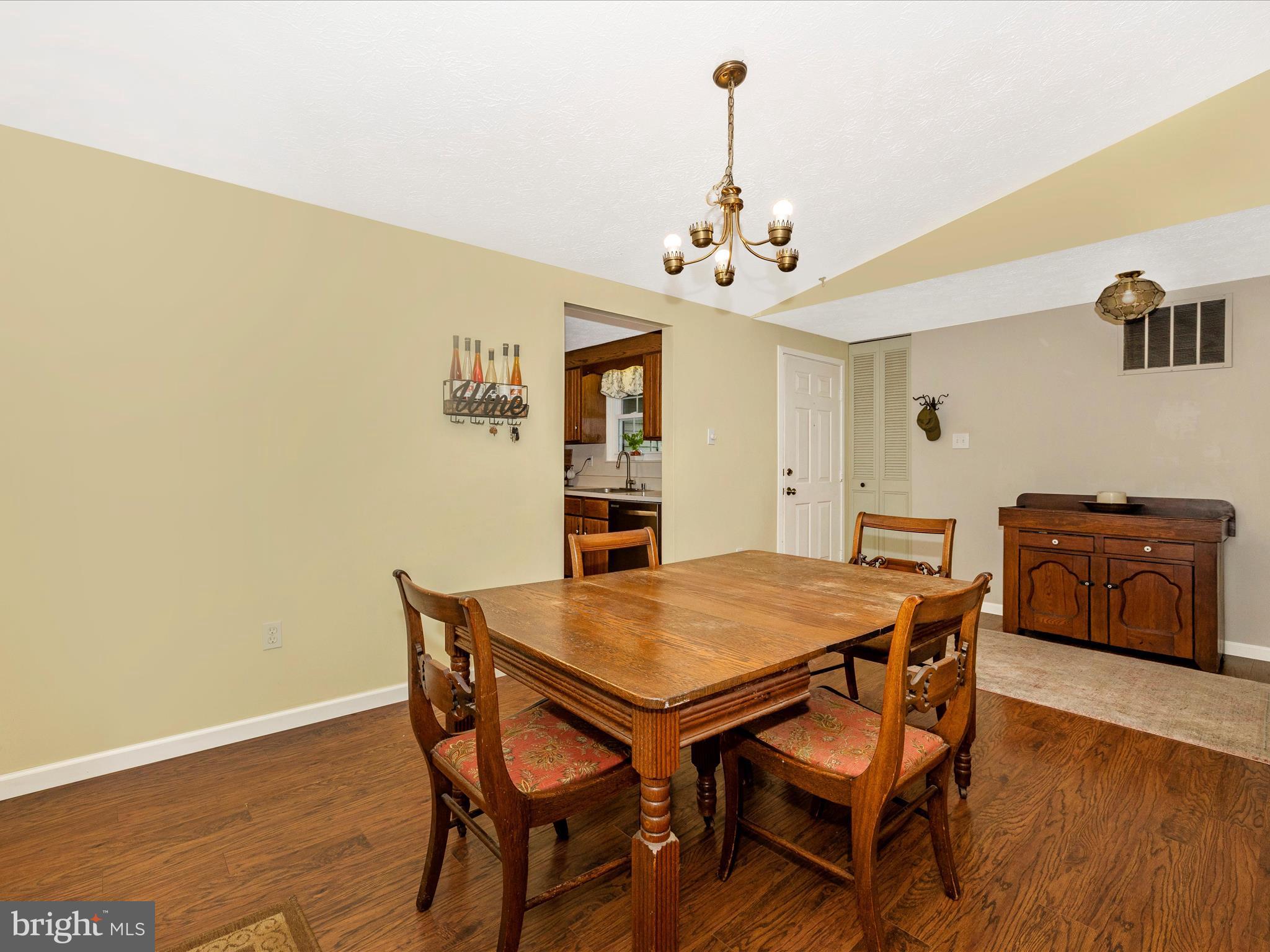 4310 Zircon Road Middletown, MD 21769 - Photo 9 of 86 a view of a dining room with furniture and wooden floor
