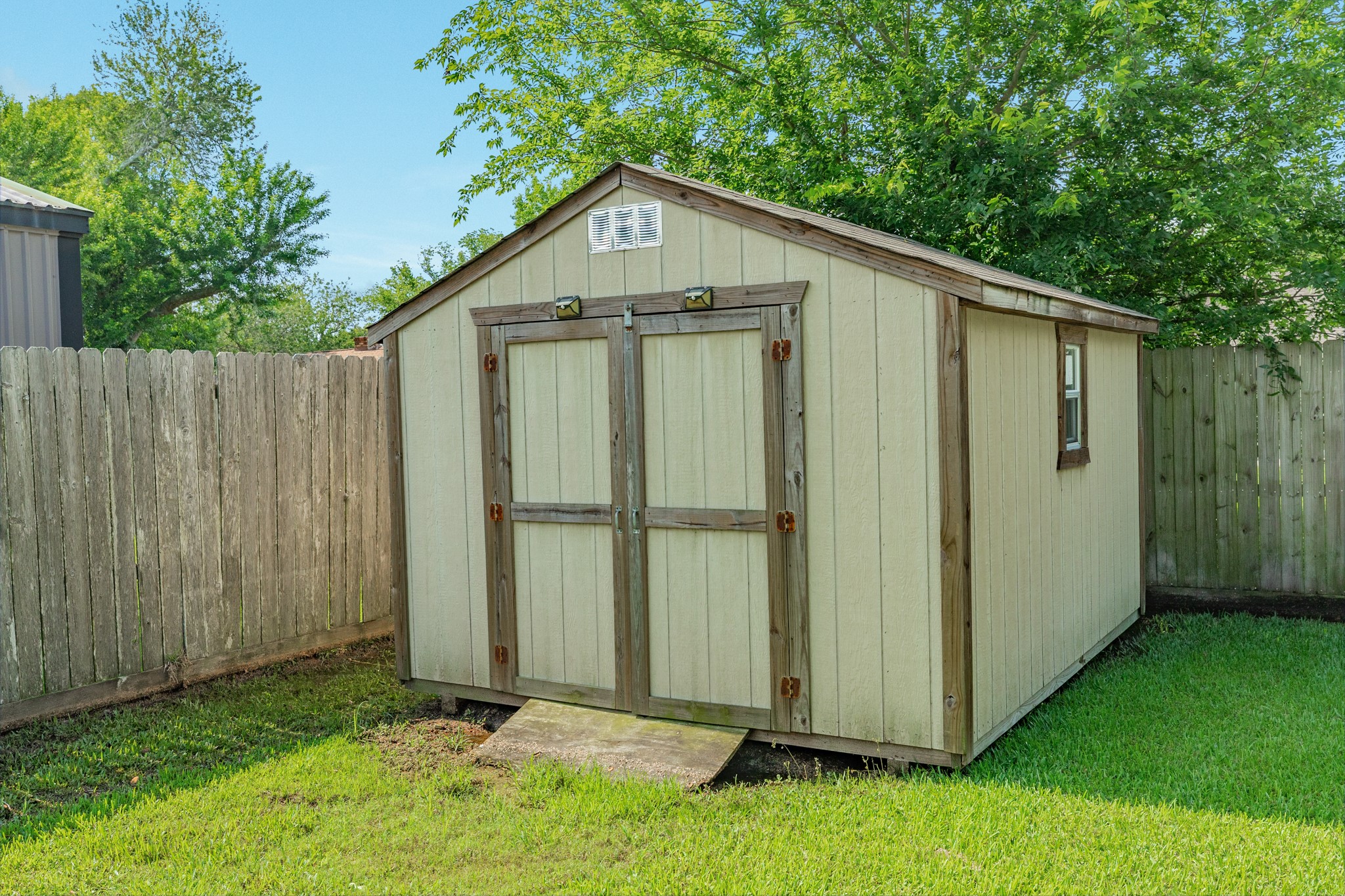 128 Houston Street Angleton, TX 77515 - Photo 18 of 25 a front view of a house with a yard