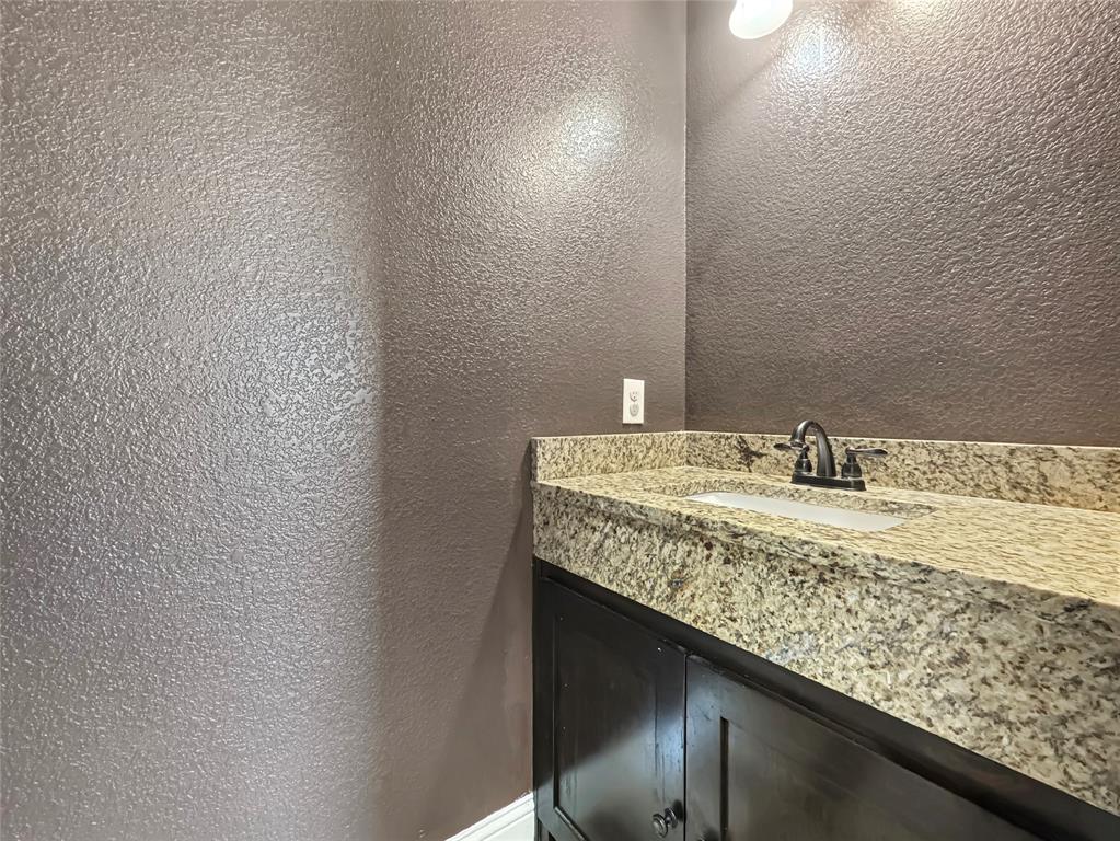 151 Crump Circle Red Oak, TX 75154 - Photo 15 of 21 Bathroom with a textured wall and vanity