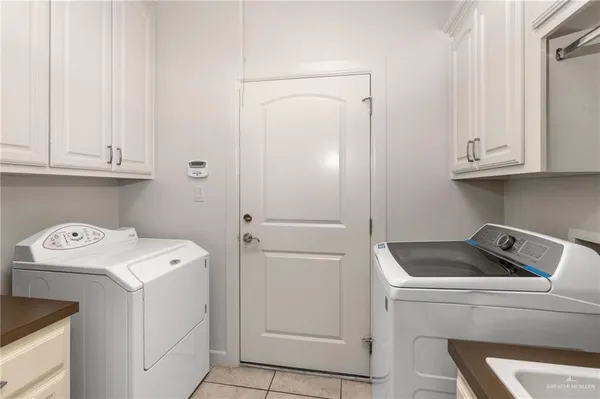 a bedroom with furniture and wooden floor