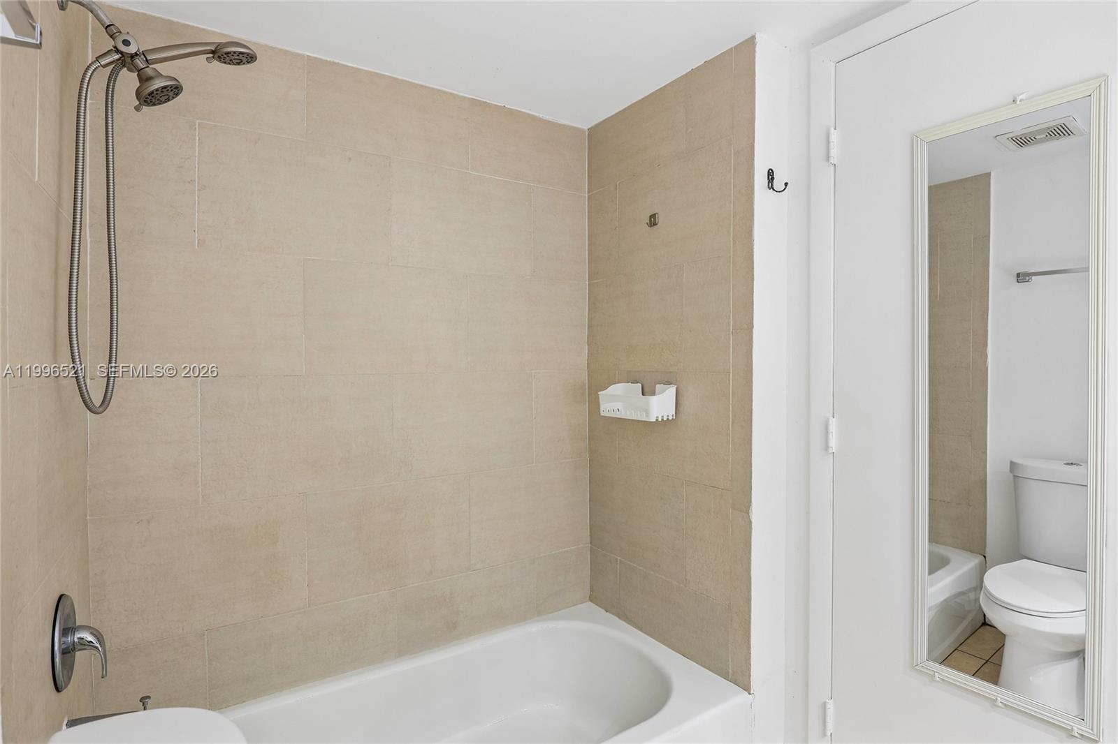 4137 Stirling Road, Unit 507 Dania Beach, FL 33314 - Photo 18 of 20 a bathroom with a bathtub and a toilet